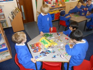 Green Group completing jigsaws.